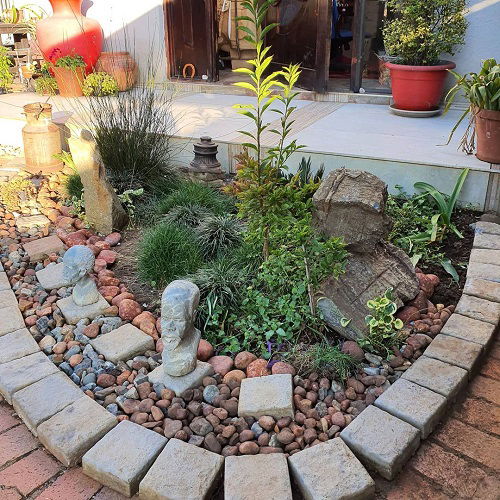 Pebbles Lining the Flower Bed